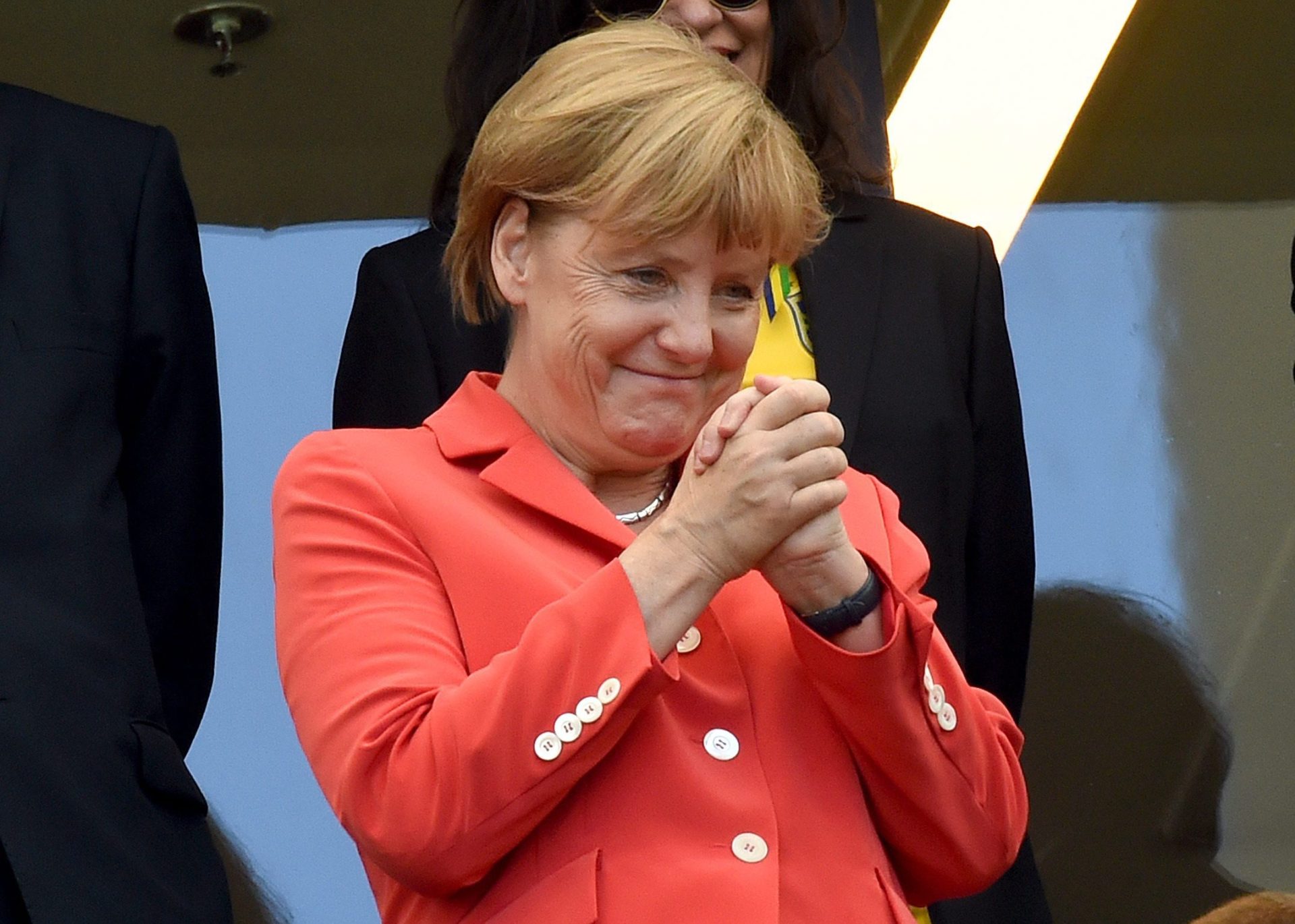 Merkel interrompe o banho dos jogadores alemães